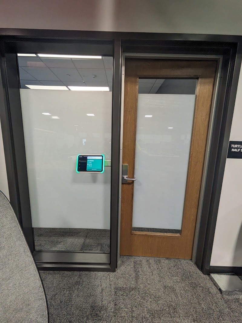 Office glass with frosted film beside a door
