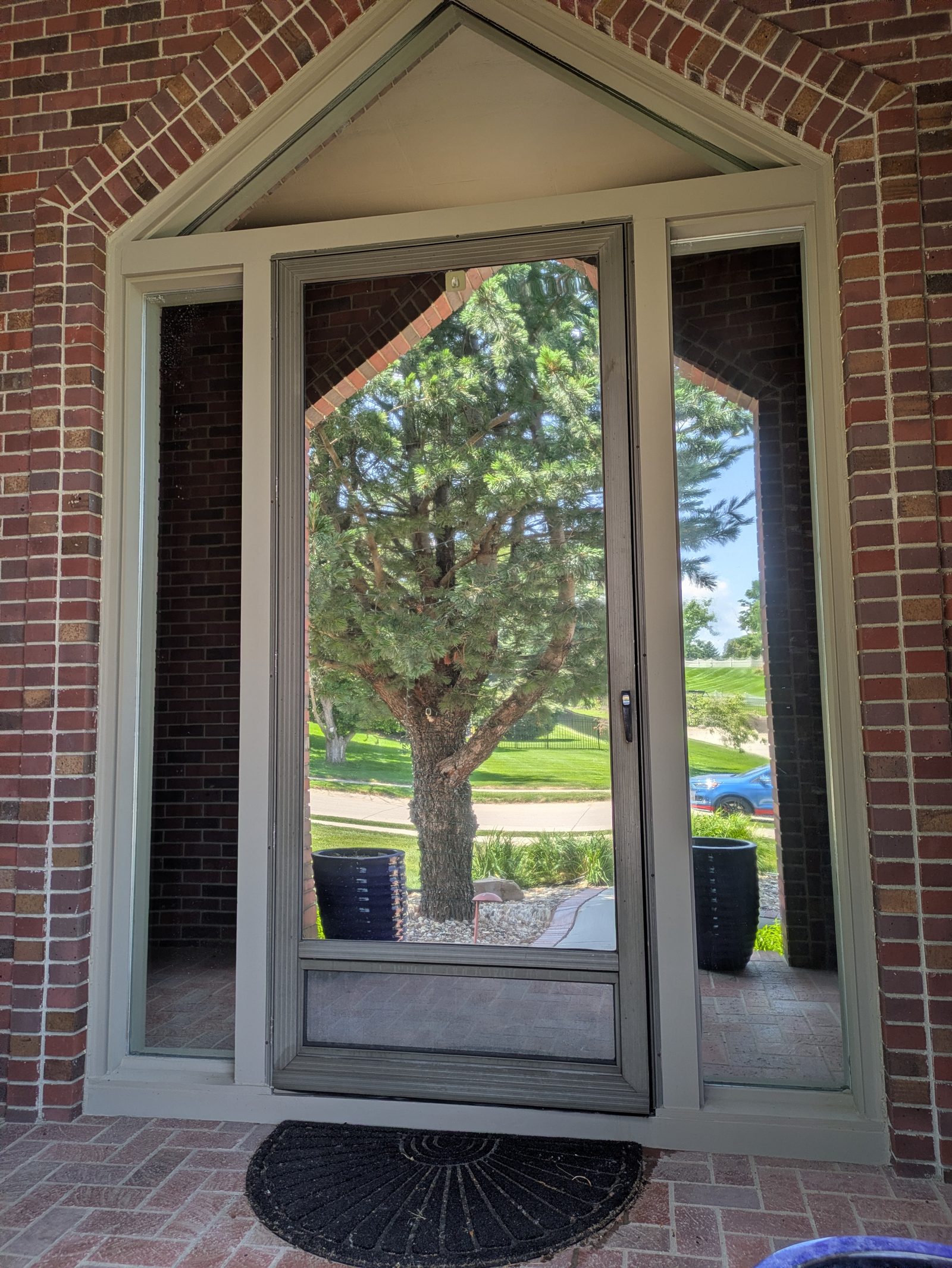 Home entry with tall glass door and sidelites