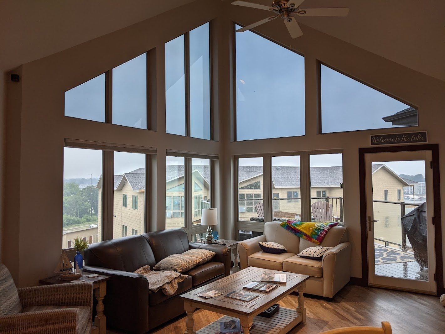 Great room with tall gable windows and a sofa