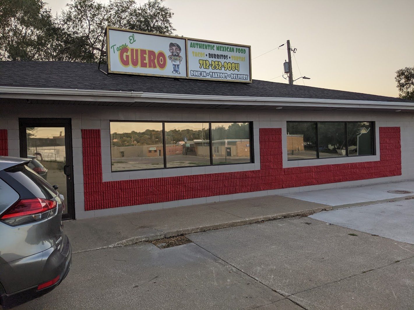 Small restaurant building with front windows