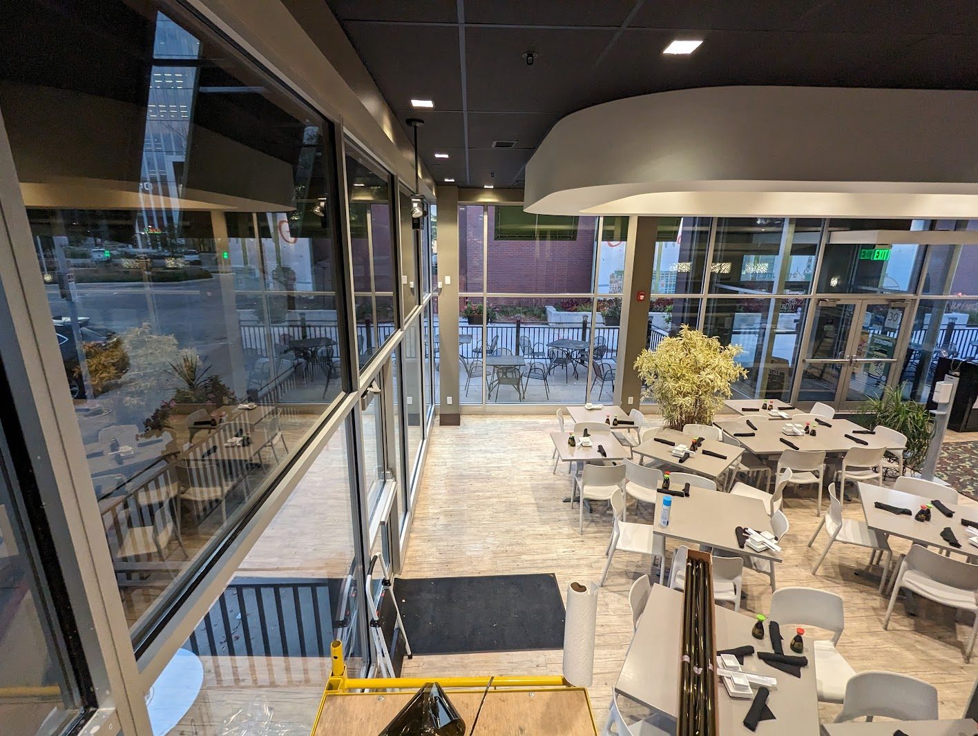 Restaurant dining room with a full glass wall